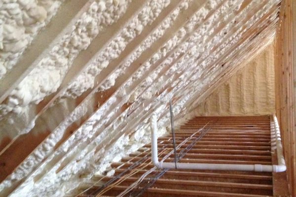 New house or home attic rafters with spray insulation for energy conservation New house or home attic rafters with spray insulation for energy conservation